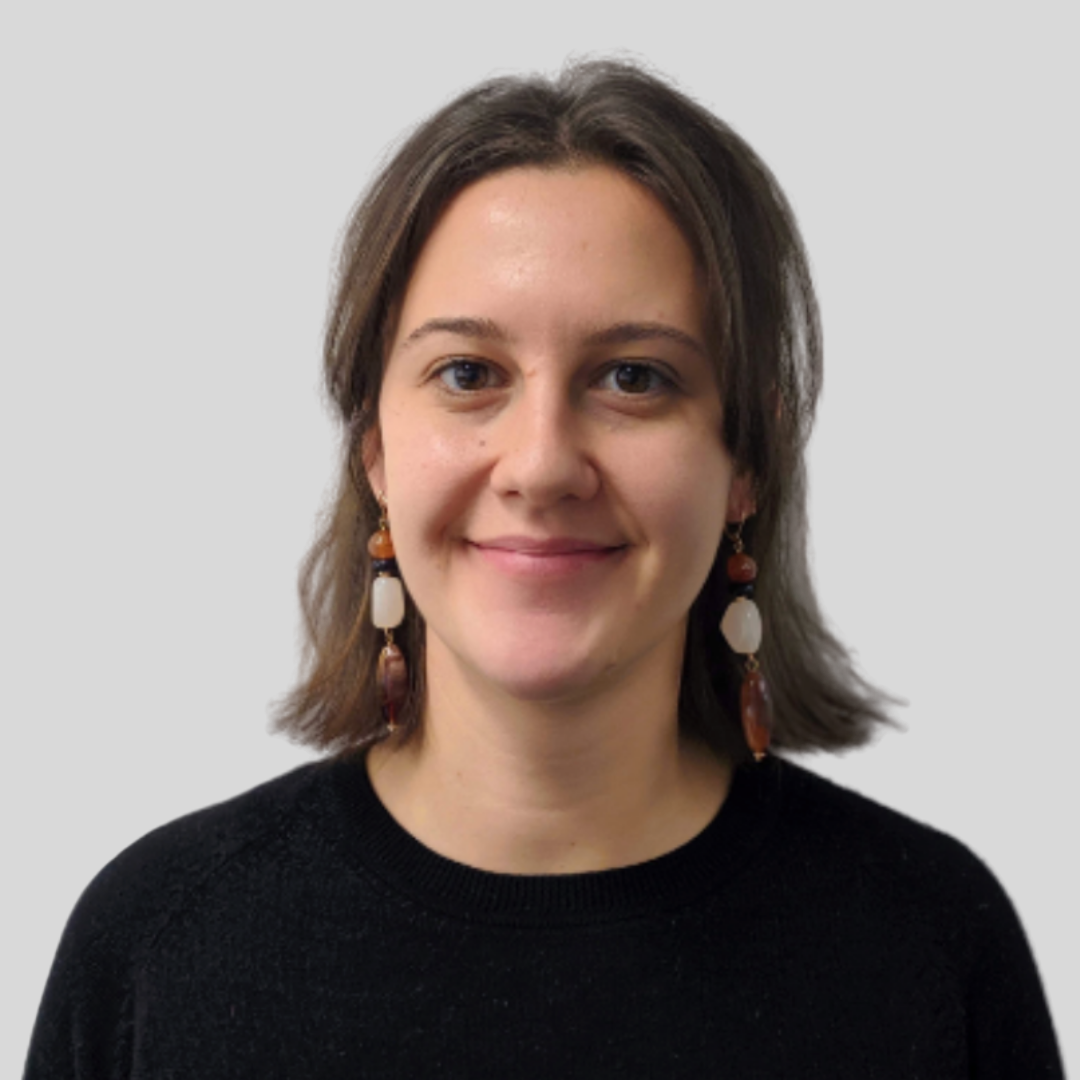 Olivia Pusey wearing a black top and beaded dangly earrings