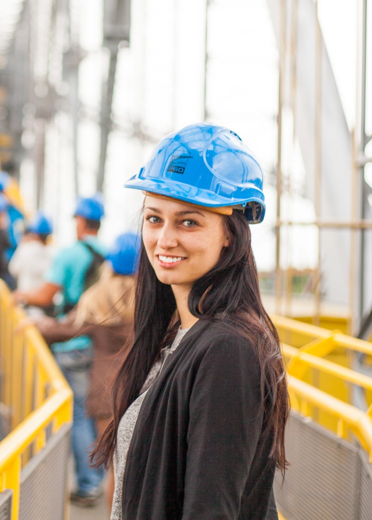 Woman smiling on a construction site.