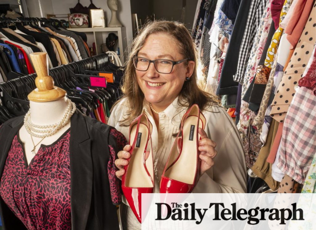 The Daily telegraph article, Fitted for Work client Willa Webb holds up a pair of red shoes and smiles